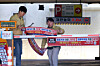 Public servants attach a banner notifying users of the two-day rotation driving and parking system at a parking space at Buk District Office in Gwangju on April 7. [BUK DISTRICT]