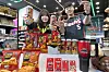 Models pose with limited-edition “Mighty Tigers” products, a collaboration between 7-Eleven and baseball club Kia Tigers, on May 3. From beer to transportation cards and chips, nine products will be launched on May 13. [7-ELEVEN]