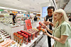 Foreign visitors take a look at Korean food products at a duty free store in central Seoul on July 18, 2025. [YONHAP]