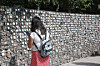 A woman reads nametags of adoptees at a monument in Paju, Gyeonggi, on June 14, 2025. [YONHAP]