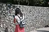 A woman reads nametags of adoptees at a monument in Paju, Gyeonggi, on June 14, 2025. [YONHAP]