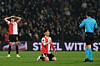 Feyenoord's Hwang In-beom, center, receives a yellow card from the referee during the Europa League opening phase football match between Feyenoord and SK Sturm Graz in Rotterdam, Netherlands, on Jan. 22. [AP PHOTO/YONHAP]