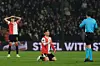 Feyenoord's Hwang In-beom, center, receives a yellow card from the referee during the Europa League opening phase football match between Feyenoord and SK Sturm Graz in Rotterdam, Netherlands, on Jan. 22. [AP PHOTO/YONHAP]