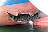 The damage caused to the HMM Namu cargo ship near the Strait of Hormuz measures 5 meters wide and 7 meters deep (16.4 feet wide and 23 feet deep), as seen in this photo shared by the Korean Ministry of Foreign Affairs on May 10. [FOREIGN MINISTRY]