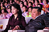North Korean leader Kim Jong-un, right, and his daughter Kim Ju-ae watch a performance marking International Women's Day on March 8 at Pyongyang Indoor Stadium, in this photo released the next day by the Korean Central News Agency. [NEWS1]