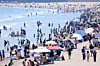 People enjoy the warm weather at a beach in Busan on May 17. [YONHAP]