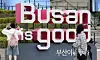 Tourists pose in front of 'Busan is good' installation in front of Busan Station in 2025. [NEWS1]