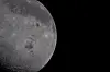 The Moon, with its Orienale basin prominent at center, is photographed by the Artemis II crew through the Orion spacecraft's window during their flyby of the Moon on April 6. [NASA/REUTERS/YONHAP]