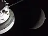 A view of NASA's Orion spacecraft in the foreground, lit up by the Sun as the Moon and Earth are visible behind it as photographed by one of the cameras on the Orion spacecraft's solar arrays during the Artemis II crew's flyby of the Moon on April 6. [NASA/REUTERS/YONHAP]