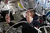 Artemis II mission specialist and Canadian Space Agency astronaut Jeremy Hansen shaves inside the Orion spacecraft during Flight Day 5 and ahead of the crew's lunar flyby on April 6. [AP/NASA/YONHAP]