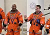 Artemis II NASA astronauts Reid Wiseman, right, and Victor Glover walk to board the astronaut van for their drive to launch pad 39B at the Kennedy Space Center in Cape Canaveral, Florida, on April 1. [REUTERS/YONHAP]