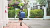A student with backpack walks along a street [SHUTTERSTOCK/ JOONGANG ILBO]