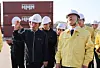 President Lee Jae Myung, right, listens to a site briefing by Jung Gu-yong, CEO of Uiwang Inland Container Depot, during a meeting with the freight transport and logistics industry on measures to cope with high oil prices at the Uiwang ICD in Gyeonggi on April 8. [NEWS1]