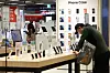 A person checks out smartphones at a supermarket in Seoul on April 15. [NEWS1]