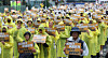 Members of Kakao's union hold signs urging for proper wage negotiations on May 20 [NEWS1]
