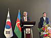 Ambassador of Azerbaijan to Korea Ramin Hasanov, left, delivers a speech during a reception celebrating the Independence Day of Azerbaijan in Seoul on Tuesday evening at the JW Marriott Dongdaemun Square Seoul. On the right is Lee Kyung-chul, special representative for Middle East peace at the Korean Ministry of Foreign Affairs. [SEO JI-EUN]