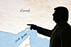 A 3D-printed miniature model depicting U.S. President Donald Trump and map showing the Strait of Hormuz, also known as Madiq Hurmuz, are seen in this illustration taken on March 26. [REUTERS/YONHAP]