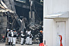 Investigators are seen outside an auto parts factory in Daedeok District, Daejeon, on March 22 after a fire broke out at the facility on March 20. [NEWS1]