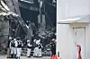 Investigators are seen outside an auto parts factory in Daedeok District, Daejeon, on March 22 after a fire broke out at the facility on March 20. [NEWS1]