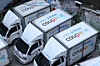 This file photo taken on Dec. 25, 2025, shows delivery trucks parked at a Coupang logistics center in Seoul. [YONHAP]