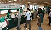 Customers attending Hana Financial Group's Hana Financial Money Show receive event information during the event held at the group's headquarters in Myeong-dong, central Seoul, on May 28. [HANA FINANCIAL GROUP]