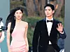 Bae Suzy and Park Bo-gum cross the red carpet after arriving at the 62nd Baeksang Awards at Coex in southern Seoul on May 8. The pair are the hosts of the event along with Shin Dong-yup. [NEWS1]