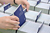 A worker organizes newly issued passports at the Suwon City Passport Office in Suwon, Gyeonggi, on July 2, 2025. [JOINT PRESS CORPS]