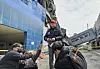 A Daejeon Metropolitan Police Agency official speaks to the press about a fire that broke out at an auto parts factory in Daedeok District, Daejeon, on March 20 while in front of the factory building on March 22. [KIM JEONG-JAE]