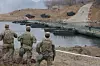 United States Forces Korea soldiers watch Stryker armored vehicles cross a pontoon bridge during a Korea-U.S. combined river crossing drill on the Imjin River in Yeoncheon, Gyeonggi, on March 14. The drill was part of the Freedom Shield combined exercise. [YONHAP]