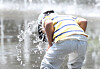 A kid plays at the water fountain in Gwanghwamun Square in central Seoul on April 30. [NEWS1]