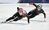 Rim Jong-un, left, skates to a first-place finish ahead of William Dandjinou, right, of Canada, during the final of the men's 1000-meter race at the ISU World Short Track Speed Skating Championships in Montreal on March 15. [AP/YONHAP]