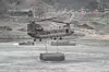 A CH-47 Chinook helicopter carries a pontoon bridge during a Korea-U.S. combined arms exercise in Yeoncheon County, Gyeonggi, on March 14. [REPUBLIC OF KOREA ARMY]