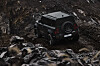 The Land Rover Defender OCTA Black drive off-road at the Destination Defender 2026 event. [JAGUAR LAND ROVER KOREA]