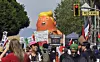Young and old make their views known near City Hall during the massive ″No Kings″ demonstration with a street-party atmosphere in Los Angeles on March 28. There were thousands of peaceful demonstrations in various cities across the United States to protest against the policies of the Trump administration. [UPI/YONHAP]