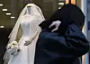 A pedestrian walks by a wedding dress shop in Ahyeon-dong, western Seoul, on March 19, 2024. [YONHAP]