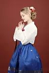Lina poses for a photo as part of her hanbok (traditional Korean dress) modeling proejct. [LINA]