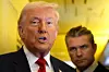 President Donald Trump speaks to reporters as Defense Secretary Pete Hegseth listens while traveling aboard Air Force One en route from Dover Air Force Base, Delaware, to Miami, Florida, on March 7. [AP/YONHAP]