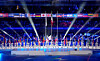 A general view of volunteers parading flags in the athletes parade during the closing ceremony at Curling Olympic Stadium in Italy on March 15 [REUTERS/YONHAP]