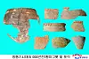 Bronze Age spinning-top-shaped vessels and fragments were discovered at a salt production site dating back about 5,000 years in Onchon County, North Korea, as shown in this photo carried by the Korean Central News Agency on April 9. [YONHAP]