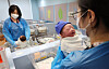 Nurses look after newborn babies at a hospital in Goyang, Gyeonggi, on March 26. [YONHAP]