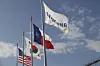 A Samsung, Texas, Korea, and United States flag hang in front of the Samsung semiconductor chip plant in Taylor, Texas, inJanuary 2024. [EPA/YONHAP]