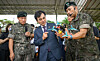 Defense Minister Ahn Gyu-back, center, listens to an explanation about small-sized drones from a soldier at a military camp in Gangwon in September 2025. [NEWS1]