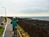 Riding in the rain-swept southwest of Jeju on April 3. Jeju Island sits very exposed in the middle of the Korea Strait, and cyclists should be prepared for all possible weather. [JIM BULLEY]
