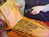 An employee rings up a bundle of garbage bags at a convenience store in Gangnam District, southern Seoul, on March 24. [NEWS1]
