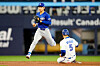 Los Angeles Dodgers' Kim Hye-seong, left, forces out Toronto Blue Jays' Daulton Varsho to end the first inning of a baseball game in Toronto on April 6. [AP/YONHAP]