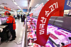Shoppers browse in the meat section of a major supermarket in Seoul on May 11, as global shipping rates rise again in the aftermath of the Middle East conflict, pushing up import costs for beef and chicken products that rely heavily on refrigerated container transport. The Shanghai Containerized Freight Index stood at 1,683 in March, up 36.3 percent from a year earlier, according to the Korea Rural Economic Institute. Korea’s beef import price rose 6.6 percent on year to $8.79 per kilogram ($3.99 per pound) in April, while chicken prices climbed 15.8 percent to $2.31 per kilogram. [YONHAP]