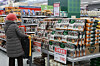 A shopper looks at groceries at a large supermarket in Seoul on Dec. 10, 2025. [YONHAP]