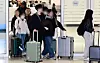 Korean tourists who were staying in Dubai, United Arab Emirates, arrive in Korea at Incheon International Airport on March 5. [JOINT PRESS CORPS]