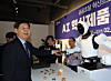 Finance Minister Koo Yun-cheol is seen visiting a robotics company on Feb. 27. [YONHAP]