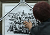 A family member breaks down in tears while touching a group photograph of the late secret military unit Silmido operatives during a joint memorial service held at a memorial hall in Goyang, Gyeonggi, on Aug. 23, 2017. [YONHAP]